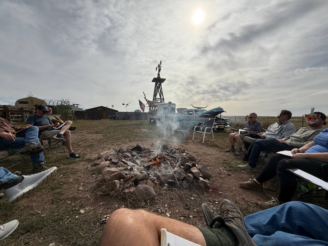 Business leaders with notepads around the fire